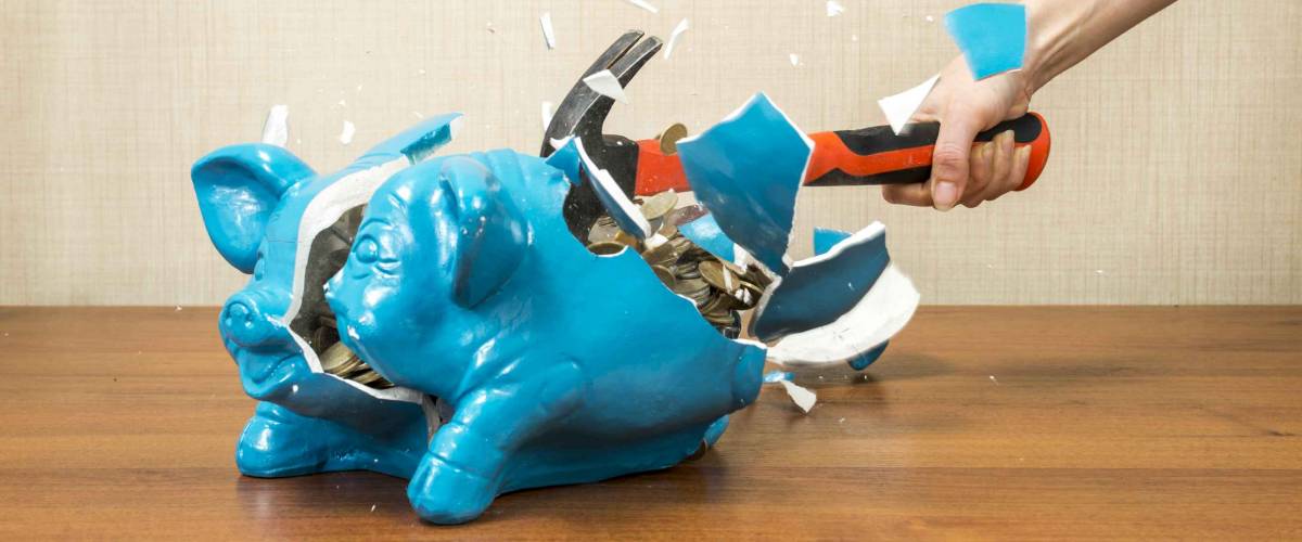 breaking the piggy bank pig