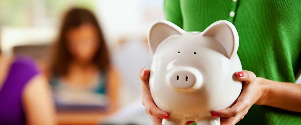 Students: Female Student Holding Piggy Bank