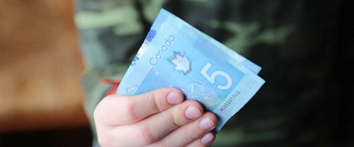 Canadian dollars representing the concept of pocket money and budget planning.