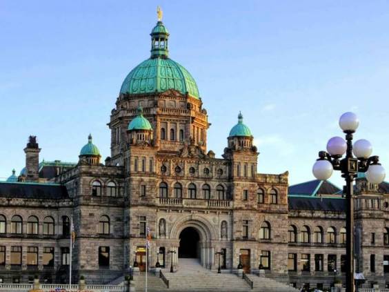 Historic British Columbia provincial parliament building with spring tulips, Victoria, BC, Canada