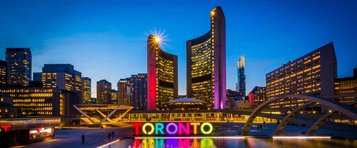 View of Nathan Phillips Square and Toronto Sign in downtown at night, in Toronto, Ontario.
