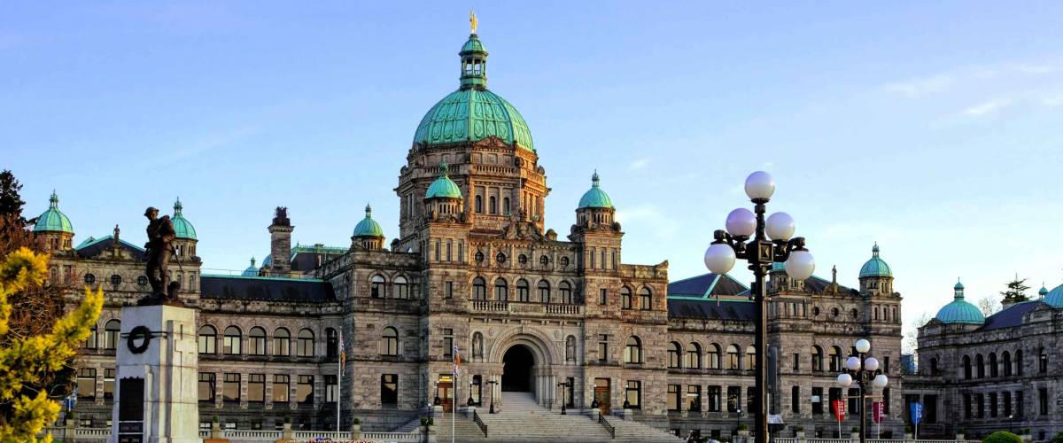 Historic British Columbia provincial parliament building with spring tulips, Victoria, BC, Canada