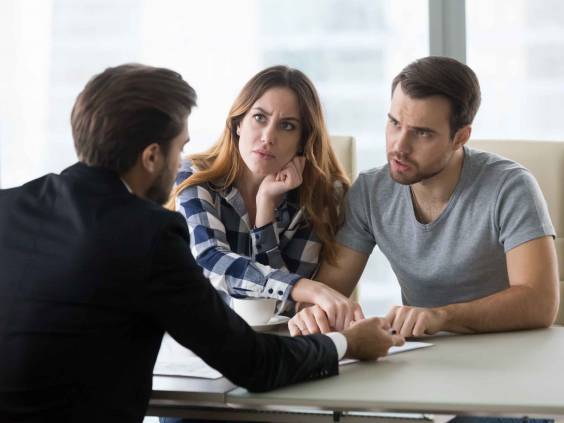 Dissatisfied couple arguing with insurer