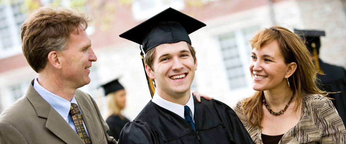 Graduation: Proud Male Student With Parents