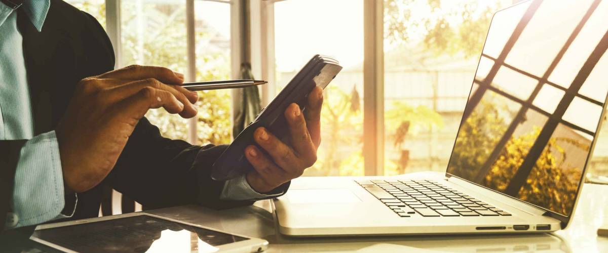 Business people sit and analyze The investment slate from the calculator with caution : Financial marketing and stock market jobs