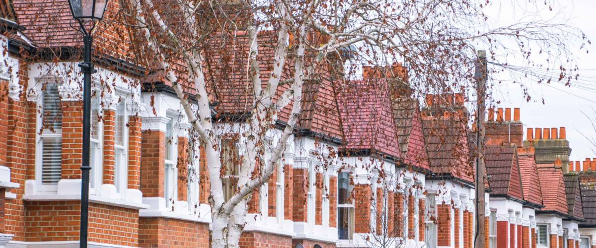 A row of typical red brick houses in suburban area of west London