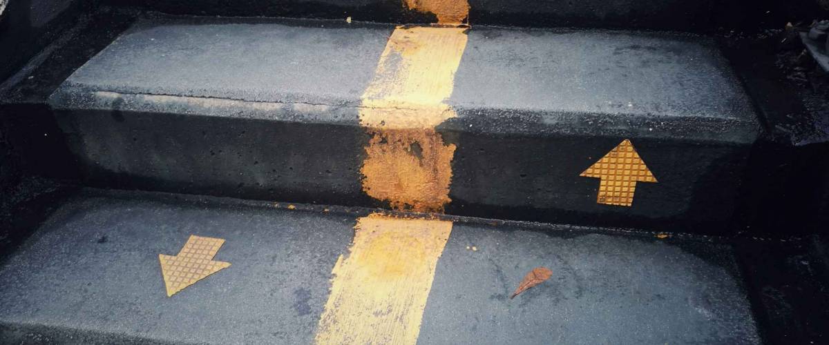 staircase with up and down arrow signs on the ground, for any work about construction, people's, life, business, and abstract concept background.