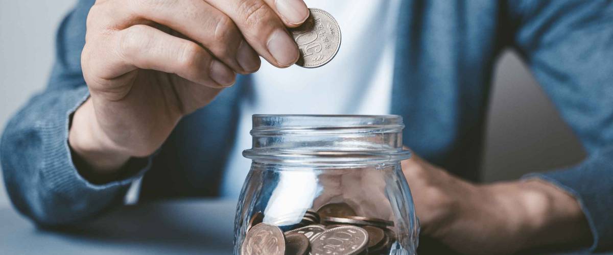 A man who saves money in a bottle