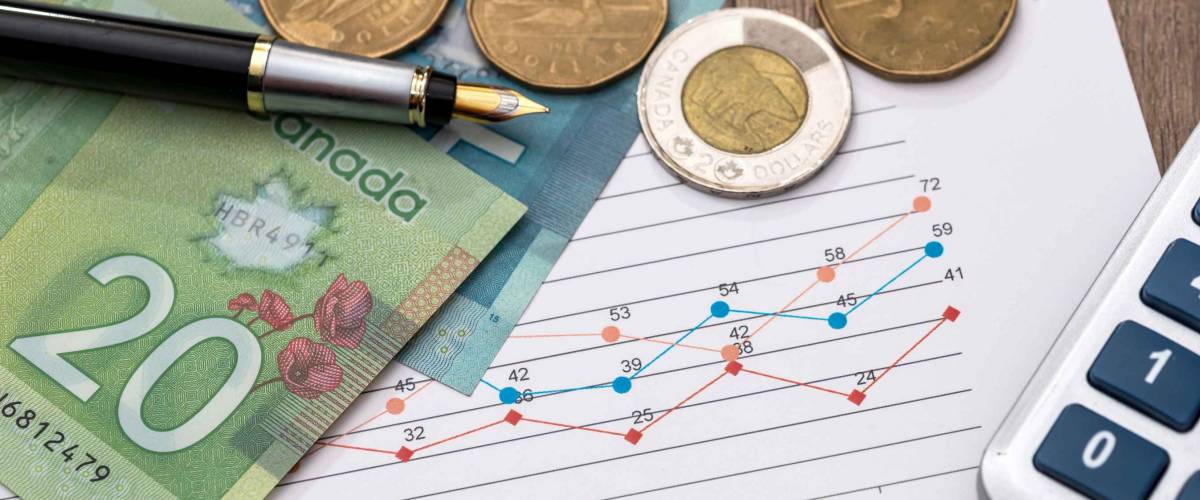 Canadian dollar with business diagram pen and calcualtor