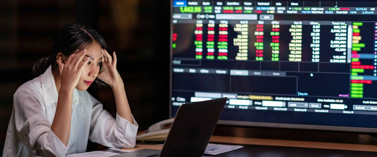 Young asian woman, owner watch investment data in laptop.