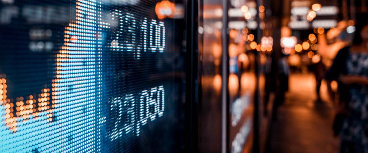 Financial stock exchange market display screen board on the street, selective focus