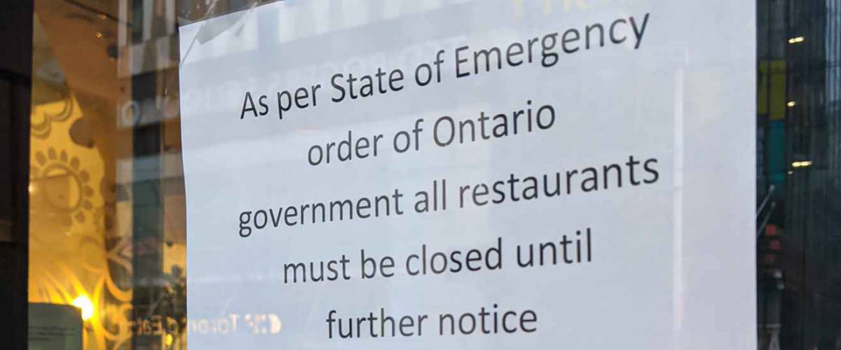 Toronto, Ontario - Mar 19, 2020: Sign on a restaurant door during covid 19 outbreak as per state of emergency order of Ontario government all restaurants must be closed until further notice.