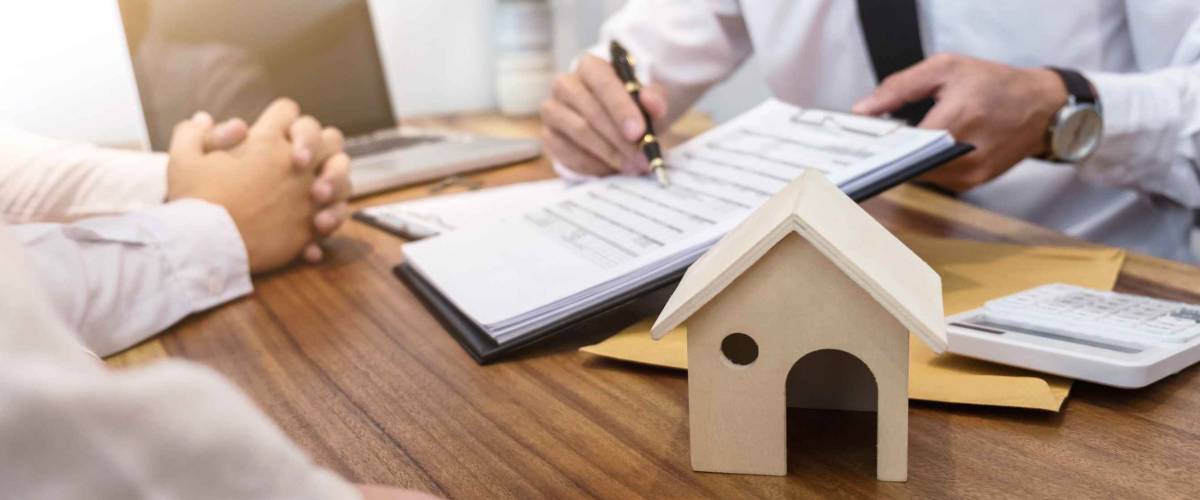 Business Signing a Contract Buy - sell house, insurance agent analyzing about home investment loan Real Estate concept.