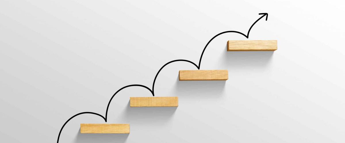 rising arrow on staircase, increasing business