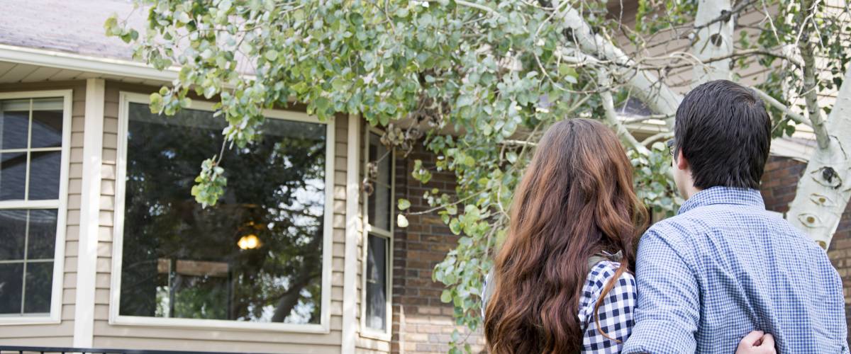 Couple looking at house