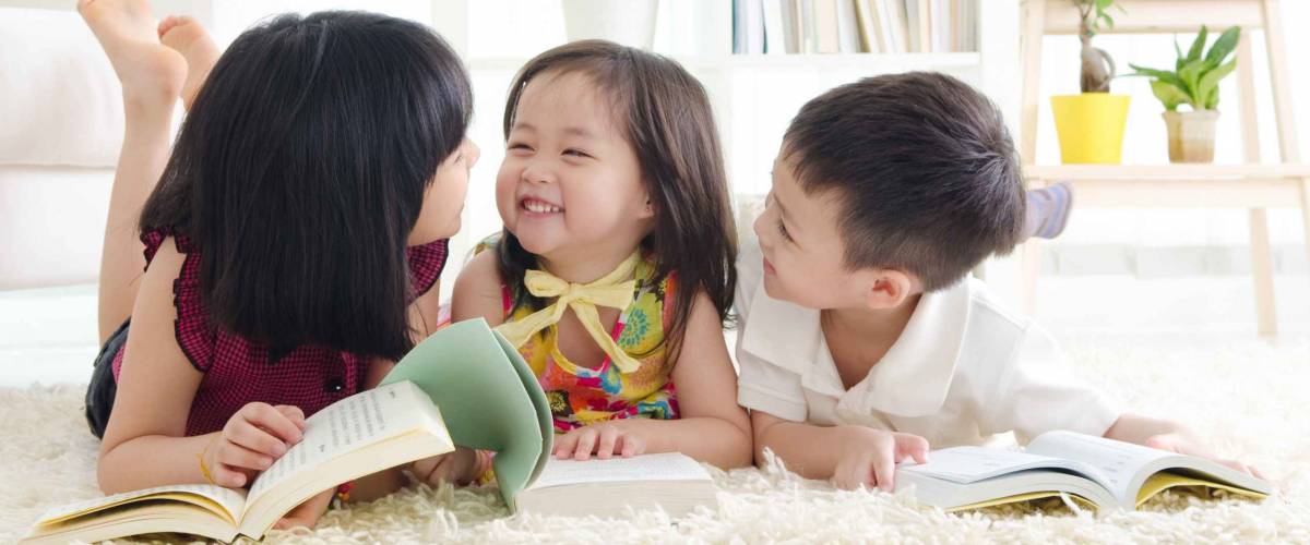 Asian kids lying on the floor