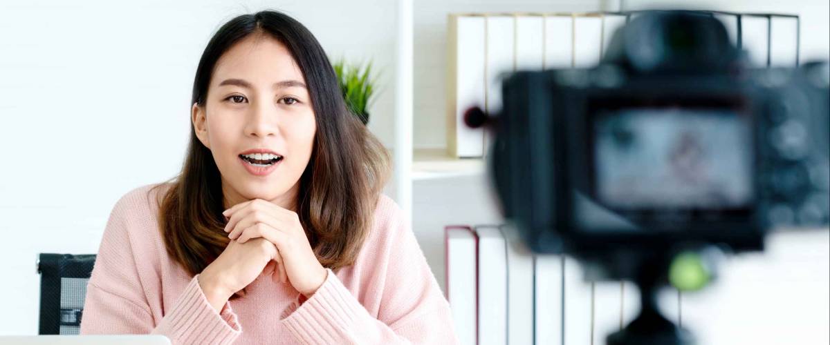 blogger or vlogger looking at camera and talking on video