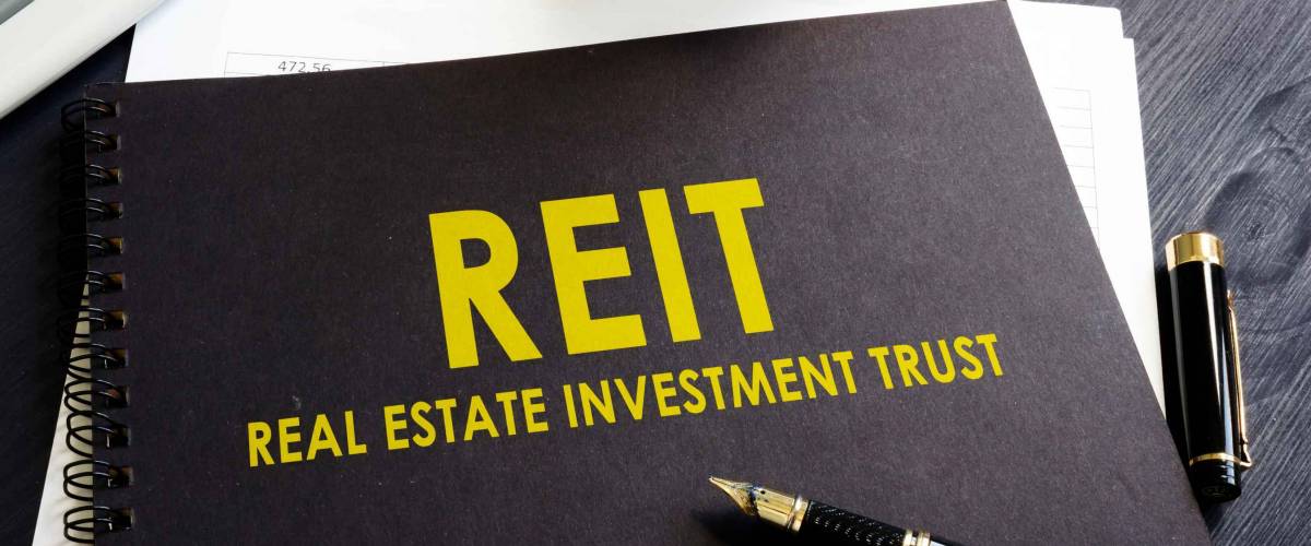 Real estate investment trust REIT on an office desk.