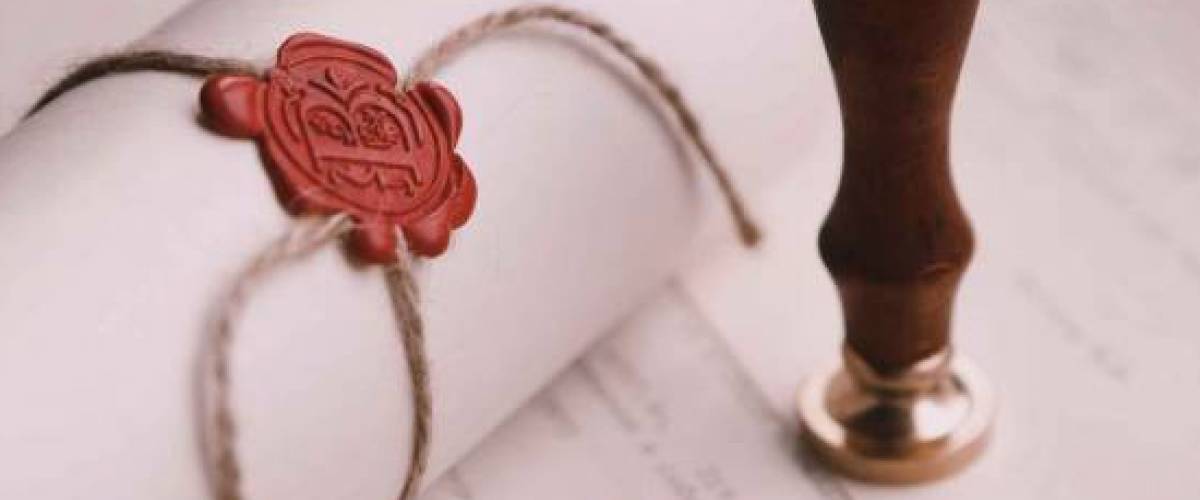Notary's public pen and stamp on testament and last will. Notary public tools