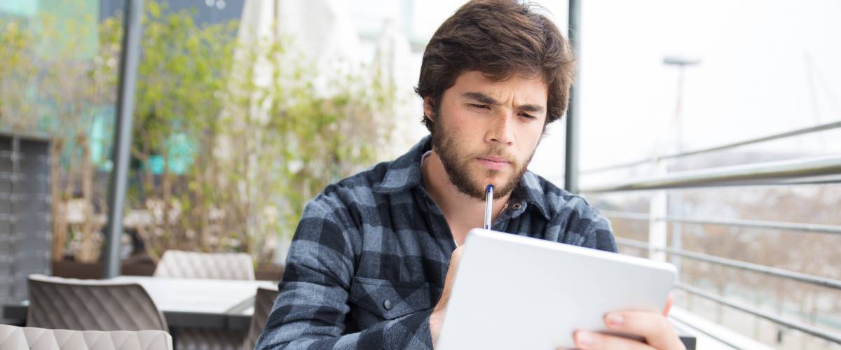 Man looking at tablet