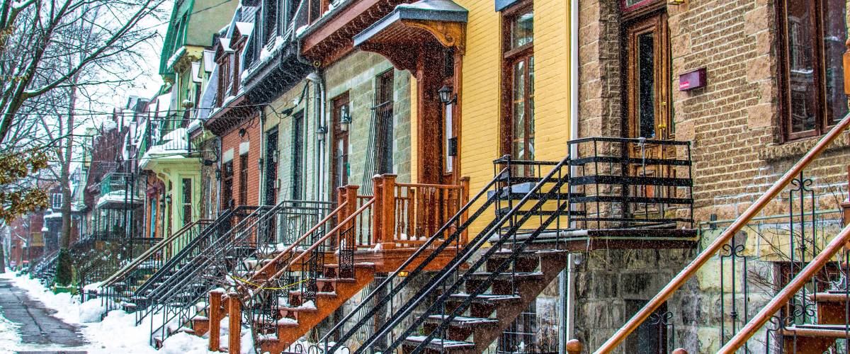Row of houses on snowy street in Montreal