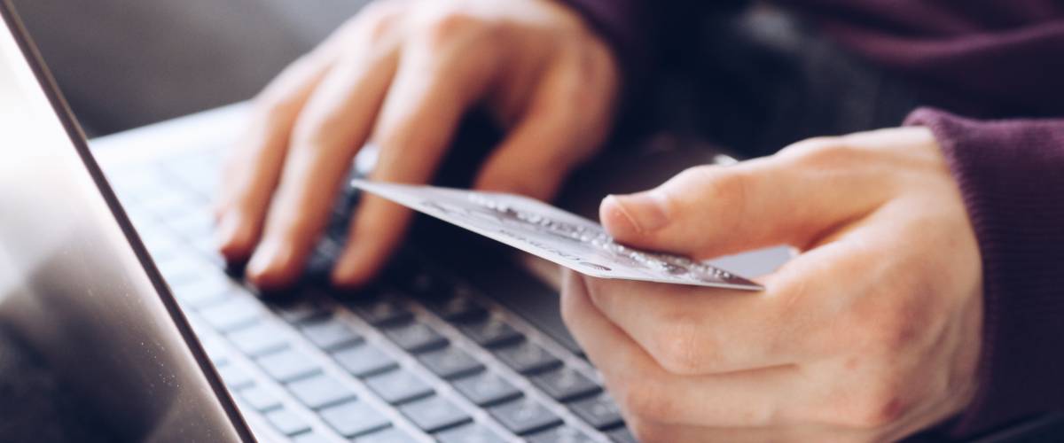 Online shopping with credit card in hand