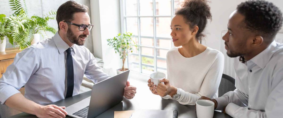 Family couple consultations with a lawyer or insurance agent. Law and insurance.