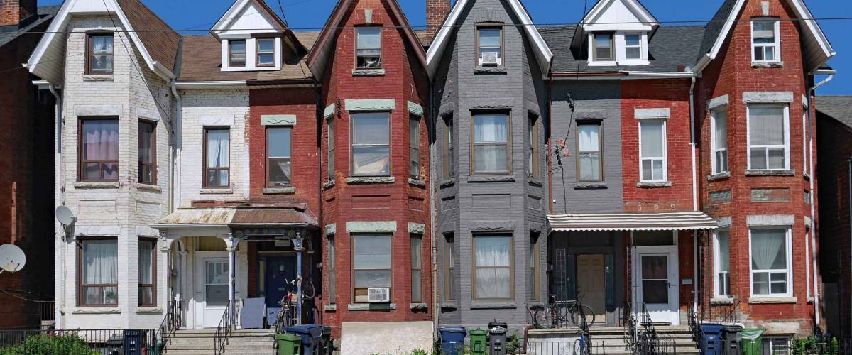 row of old Victorian urban houses with gables