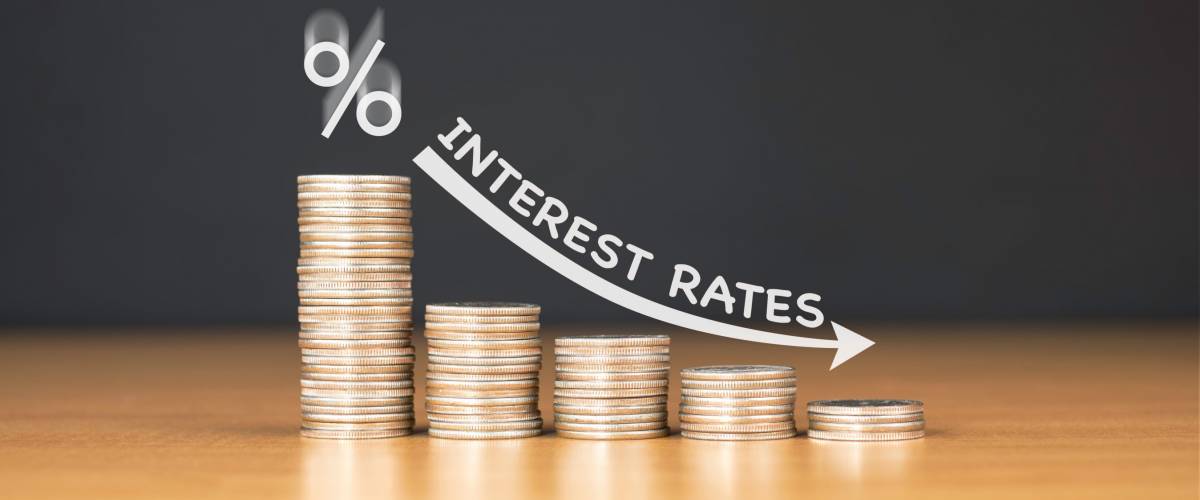 Paying down a loan, with interest applied.