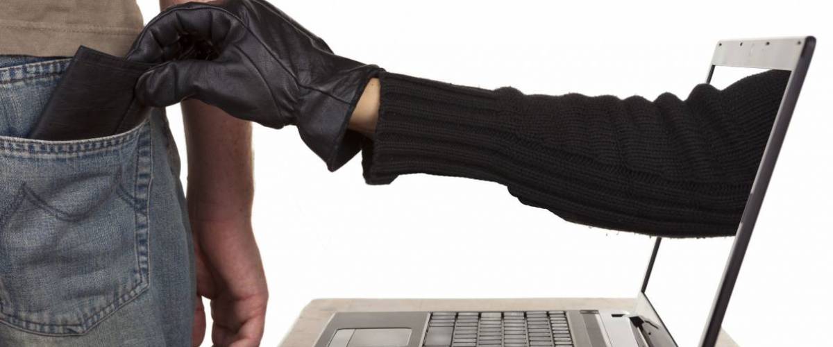 Hand takes wallet out of back pocket