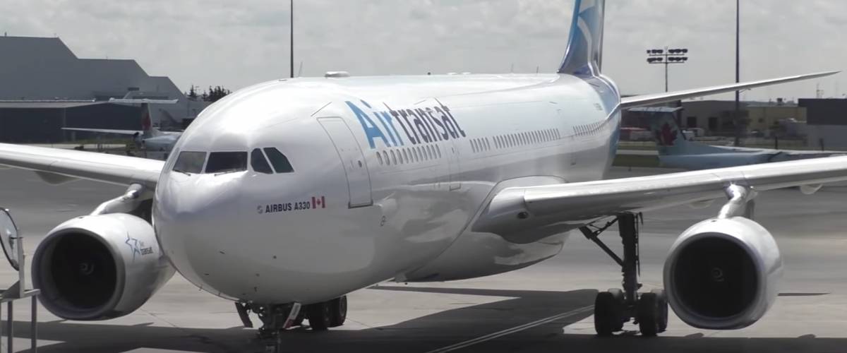 White Airplane with Air Transat logo