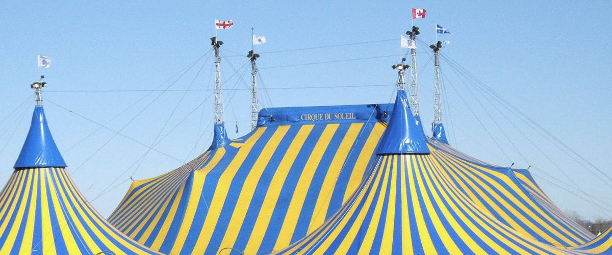 Yellow and blue striped Cirque Du Soleil tent