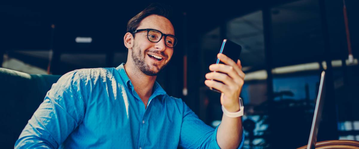 Man checking stocks on phone