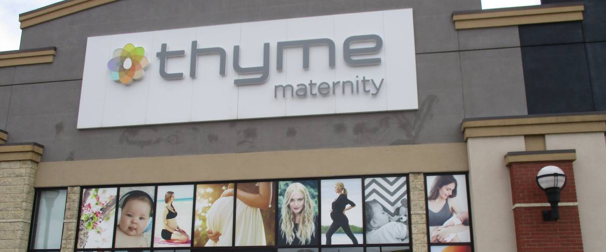 thyme maternity store external view white sign
