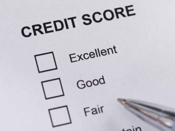 High Angle View A Person Filling Credit Score Form