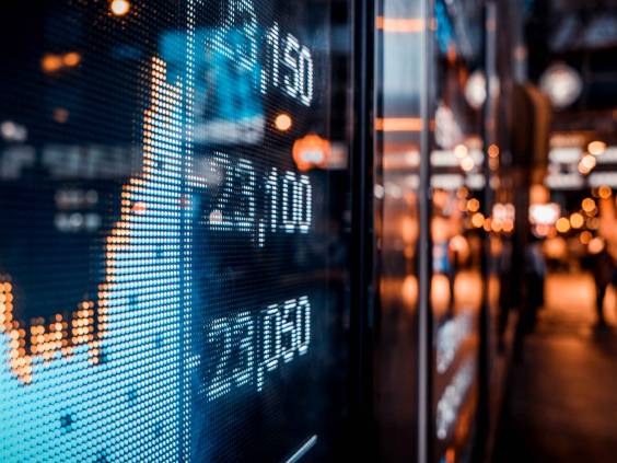 Financial stock exchange market display screen board on the street, selective focus