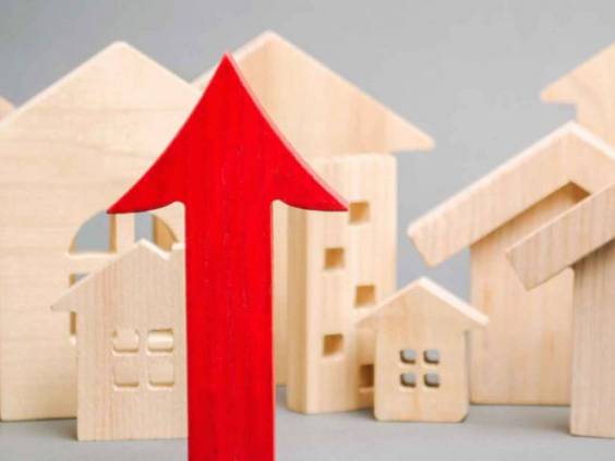 Red arrow up and miniature wooden houses.