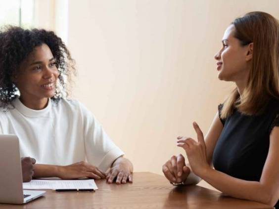 Female broker makes offer to young African ethnicity married couple
