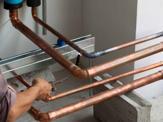 HVAC technician soldering a copper joint for Air Conditioning