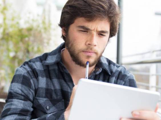 Man looking at tablet