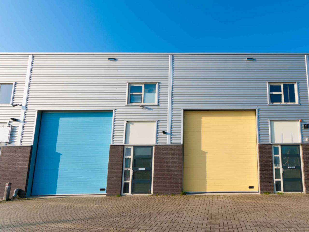 business units for small companies with colorful roller doors