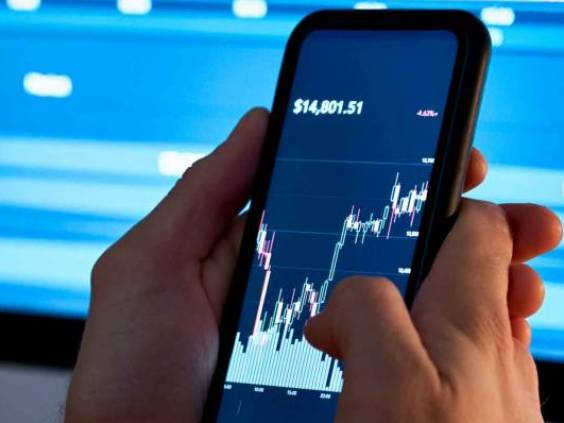 Business man trader investor analyst using mobile phone app analytics