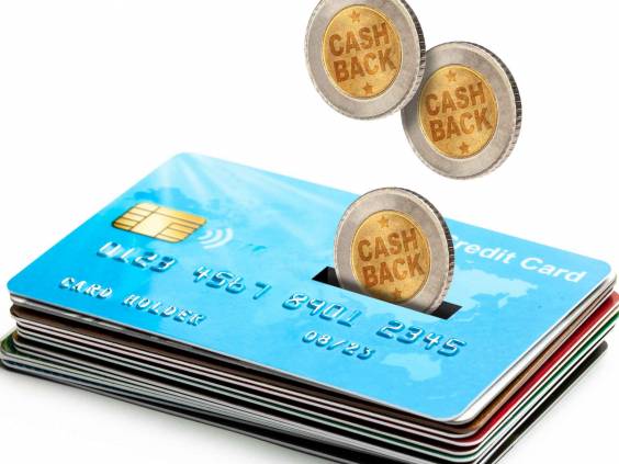 Coins Cashback falls into a credit card. Refund. Bonus payments after the purchase. Isolated on a white background.