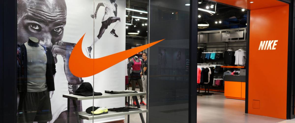 Nike store front in shopping mall. Nike is an American multinational corporation that design, manufacturing, marketing and sales athletic shoes and apparel.