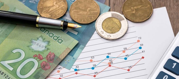 Canadian dollar with business diagram pen and calcualtor