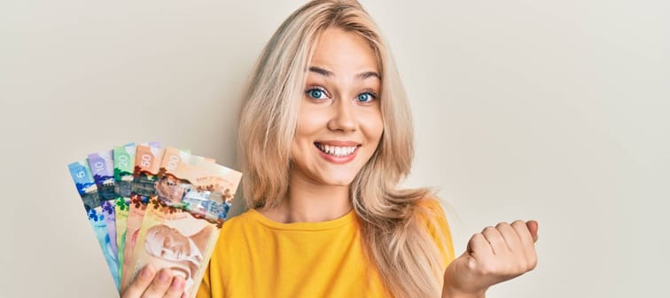 Blonde woman with canadian bills