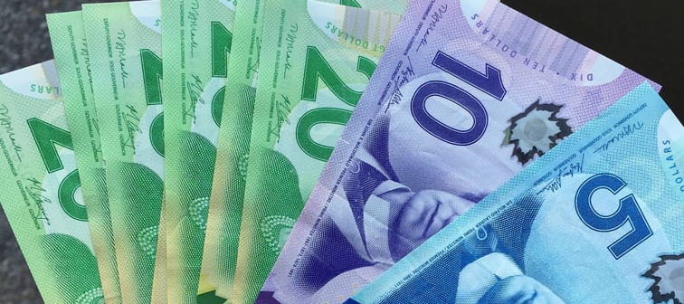 Canadian money in hand