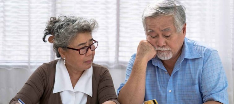 Elderly Asian couples suffering from debt problems, Living after retirement.