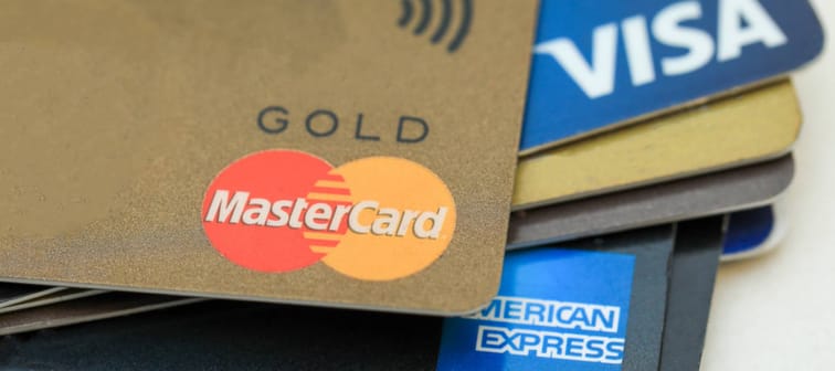 A stack of an American Express, MasterCard and Visa credit cards