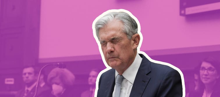 Federal Reserve Chair Jerome Powell testifies before Congress with a pinched look on his face.